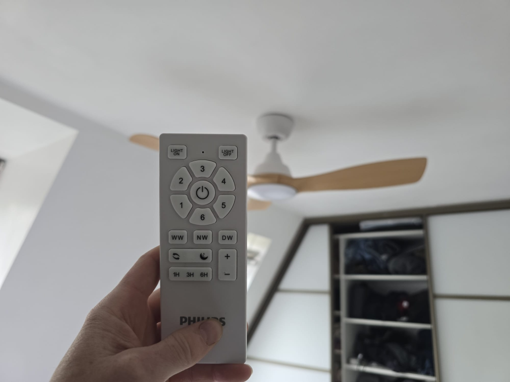 Philips Olas ceiling fan remote control showing speed and light controls