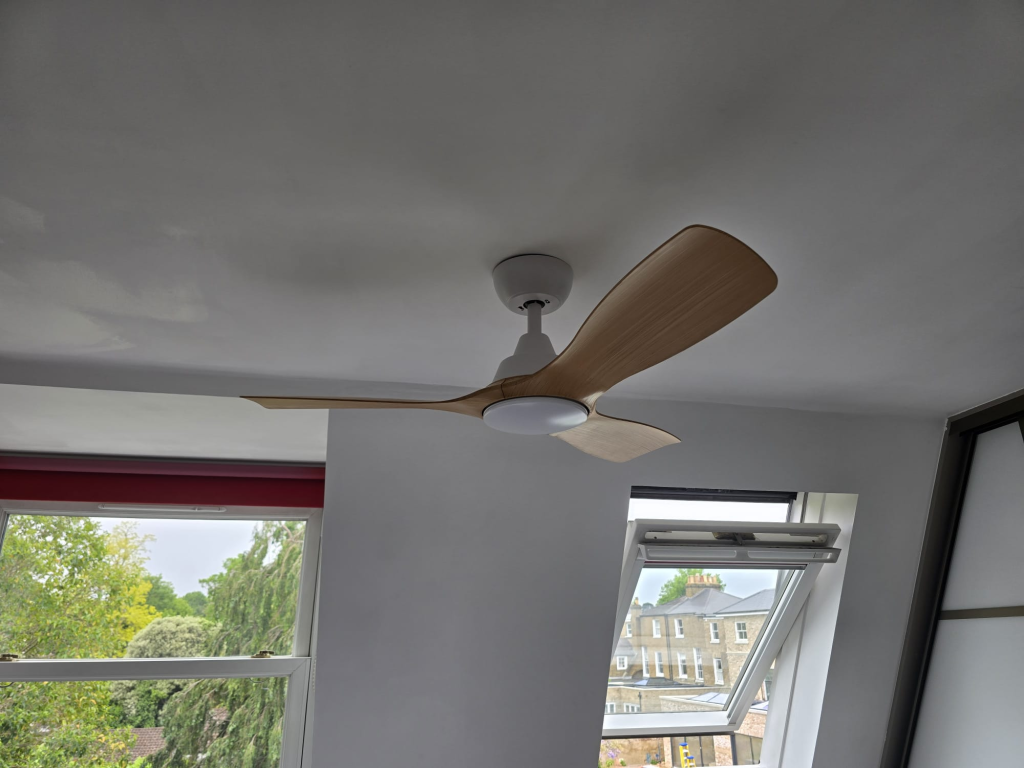 Philips Olas ceiling fan installed on a white bedroom ceiling