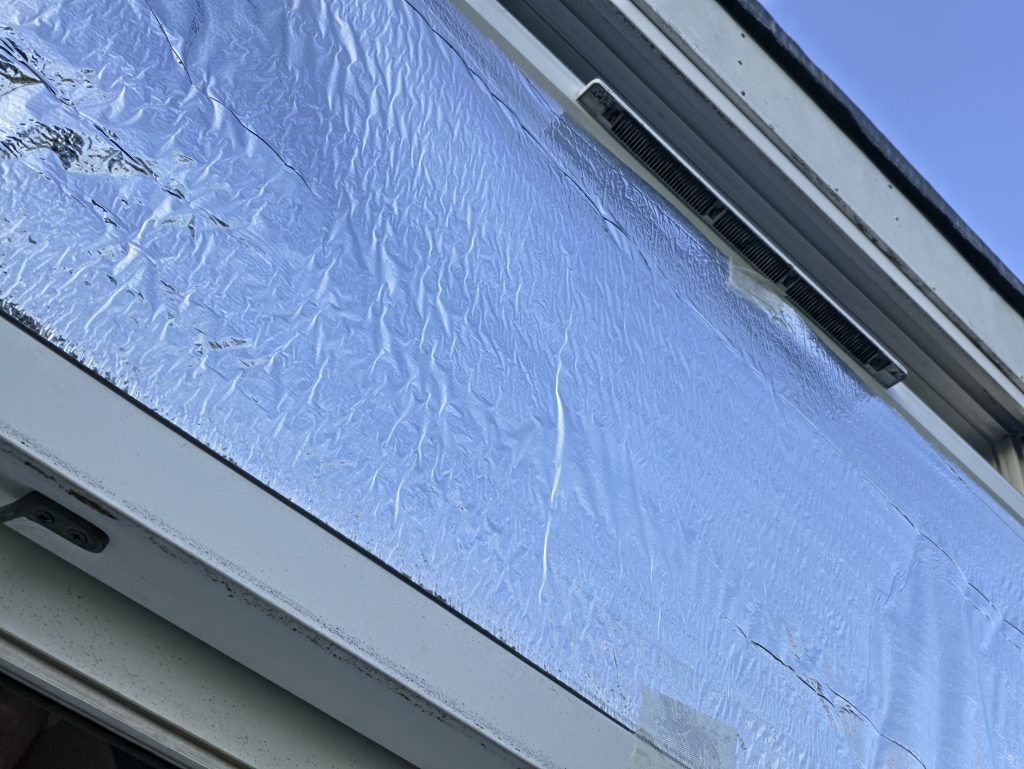 The crinkled foil on the window from a slightly different angle.